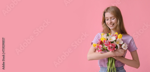 Happy young woman with bouq...