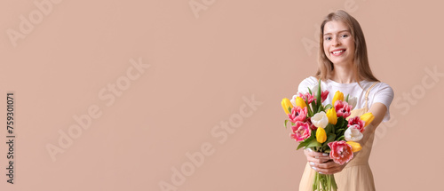Happy young woman with bouq...