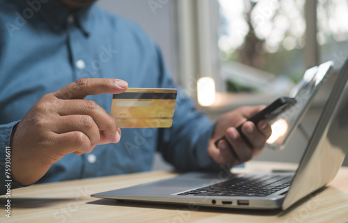 concept shopping online Pay by credit card. man hand holding credit card using smartphone make financial transactions. internet banking, store online, payment, spending money, e-commerce payment.