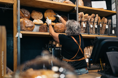 Bakery Worker Holding Bread
