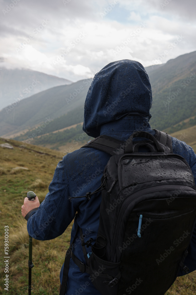 Mountain Hiker Wears Backpack at Stunning Landscape with Dramatic Sky Mountain Hiker Wears Backpack at Stunning Landscape with Dramatic Sky