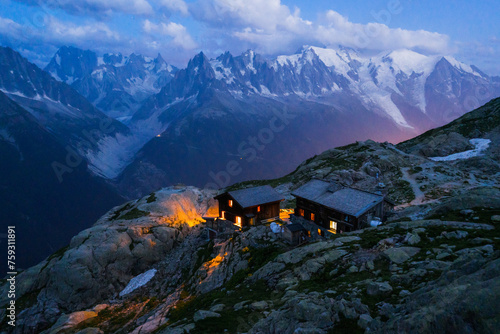 Mountain refuge with view of Mont Blanc massif at dusk photo
