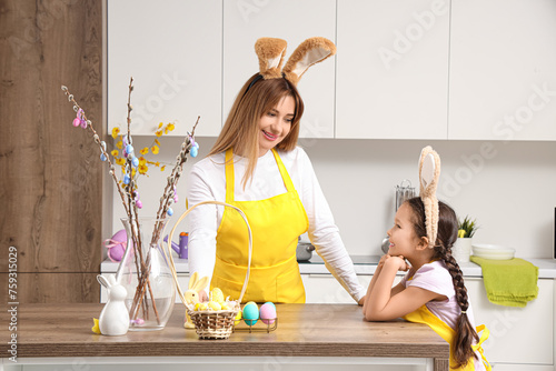 Cute little girl with her m...