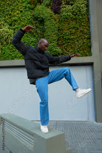 A portrait of an AfricanAmerican man playfully contorting. photo