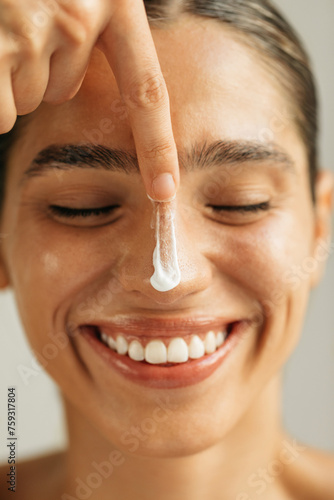 Woman applying cream