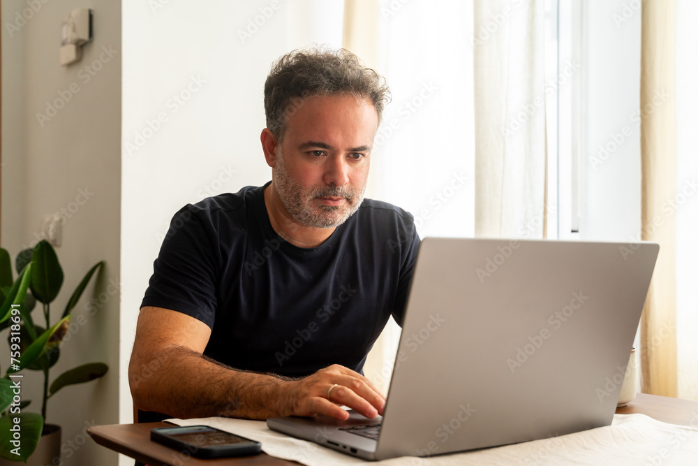 Man Using Laptop Indoors Man Using Laptop Indoors
