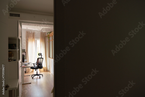 View Of Desk And Office Chair In The Room photo