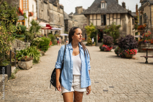young tourist visiting a nice town in french brittany