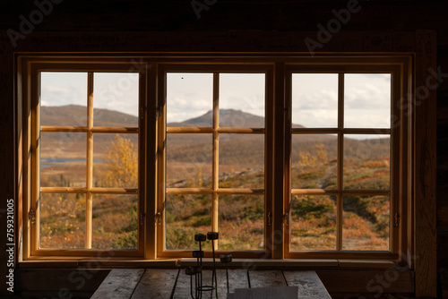 Window cabin in the mountain photo