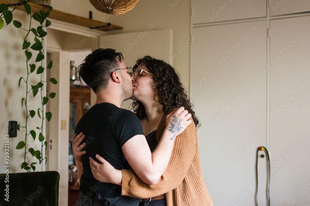 Couple kissing at home