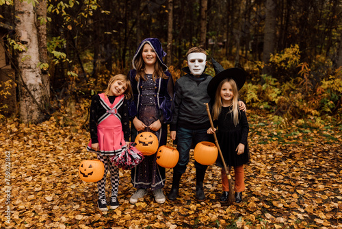 Kids Trick or Treating In Halloween Costumes photo