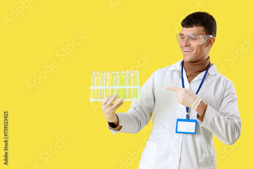 Male chemist with test tube...