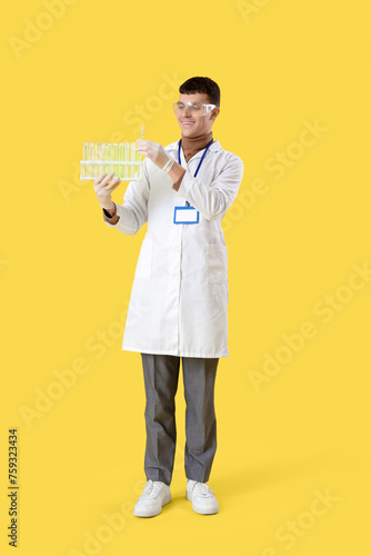Male chemist with test tube...