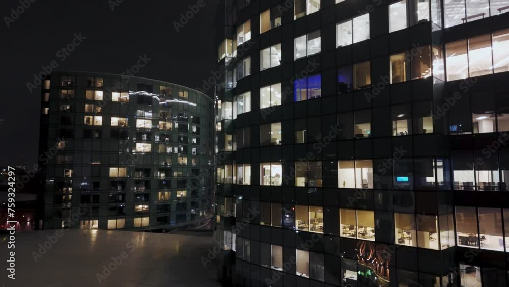 Aerial view at night Windows of the Skyscraper office, Corporate building in Halifax, Canada. Corporate building with employees working late into the evening in skyscraper offices. Aerial view at night Windows of the Skyscraper office, Corporate building in Halifax, Canada. Corporate building with employees working late into the evening in skyscraper offices.