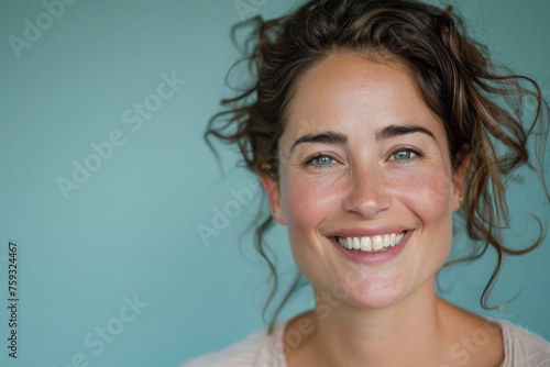 A close up of a woman 's face with a blue background