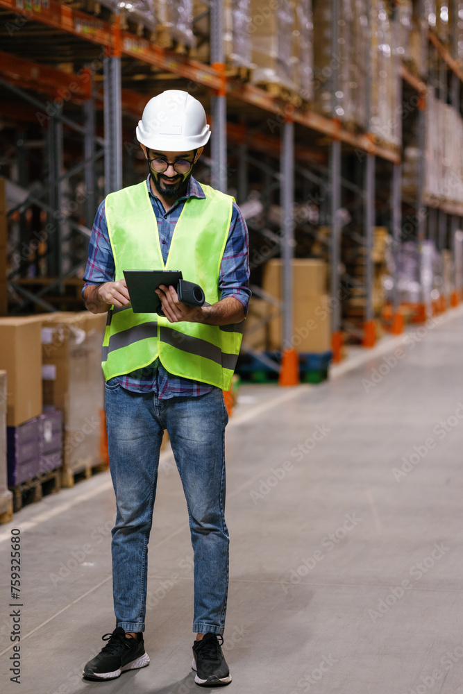 Caucasian employee processing data storage aisle Caucasian employee processing data storage aisle