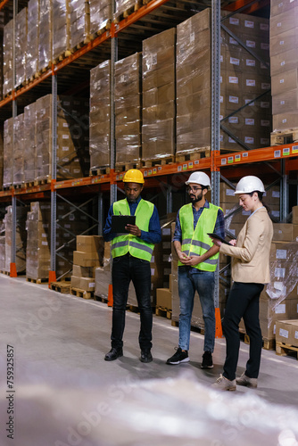 Working together storekeepers soss managing inventory warehouse photo