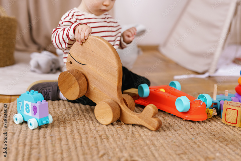 © Oleksii Syrotkin/Stocksy - Toddler toys play faceless alone bedroom cozy activity © Oleksii Syrotkin/Stocksy - Toddler toys play faceless alone bedroom cozy activity