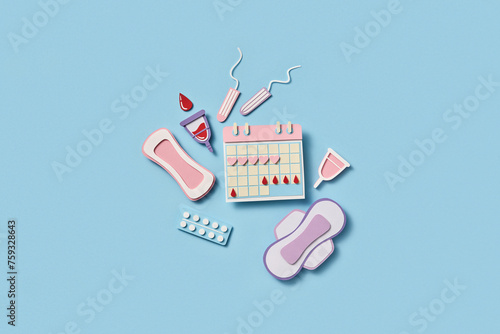 Menstrual calendar with various feminine products on blue background