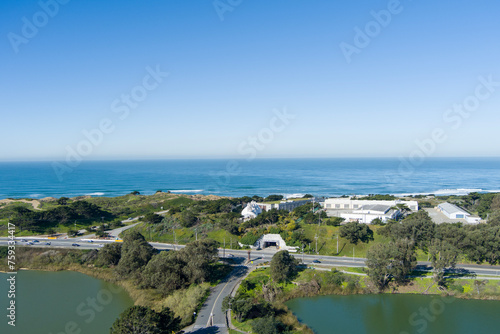 Photography aerial shot of a beautiful spring landscape at Lake Merced with vast blue ocean