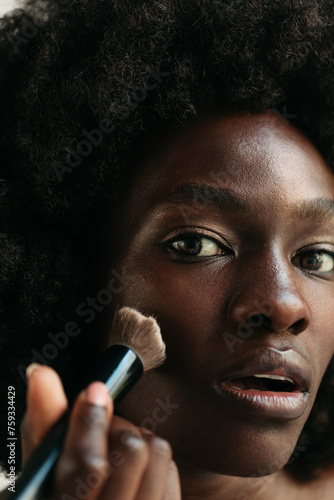 Woman using makeup brush