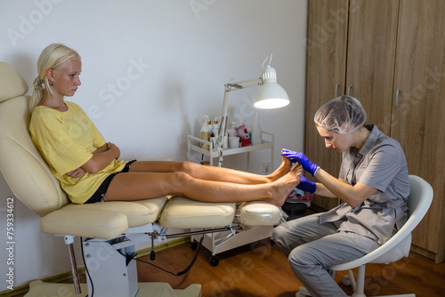 Teen girl at chiropodist appointment photo