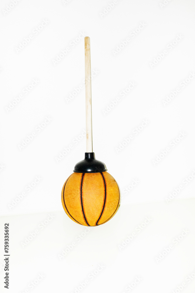 Suction cup / plunger and basketball with hard direct flash Suction cup / plunger and basketball with hard direct flash