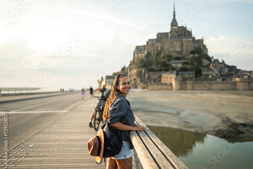 young woman on mont saint michel in france