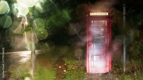 A red telephone box at night photo