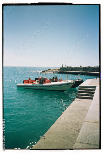 Italian mediterranean sea with turist boat photo