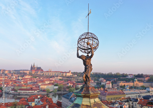 Ancient atlas statue above Prague photo