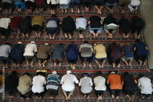 Muslim People Praying Salah Doing Prostration Together at Mosque
