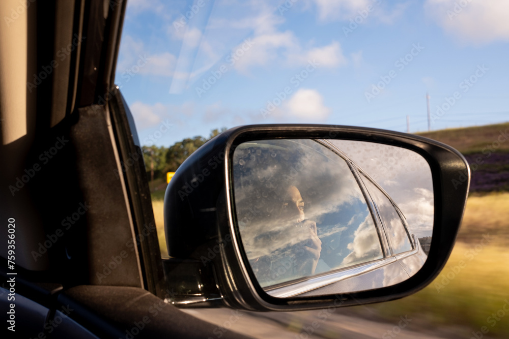 Woman Taking Photos In The Rear View Mirror Woman Taking Photos In The Rear View Mirror