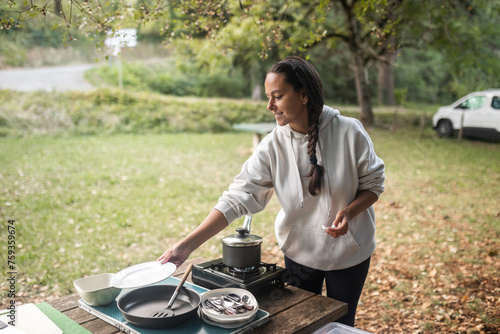 woman with her van eating outdoors in nature photo