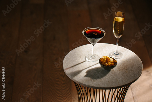 Espresso Martini, a glass of sparkling wine and pototo chips photo