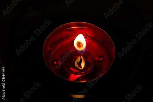 a candle on Christmas night
