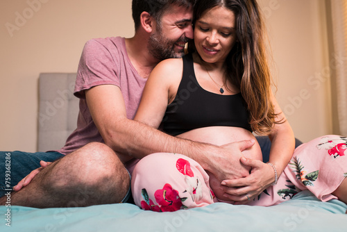 Couple enjoying the excitement of becoming parents photo