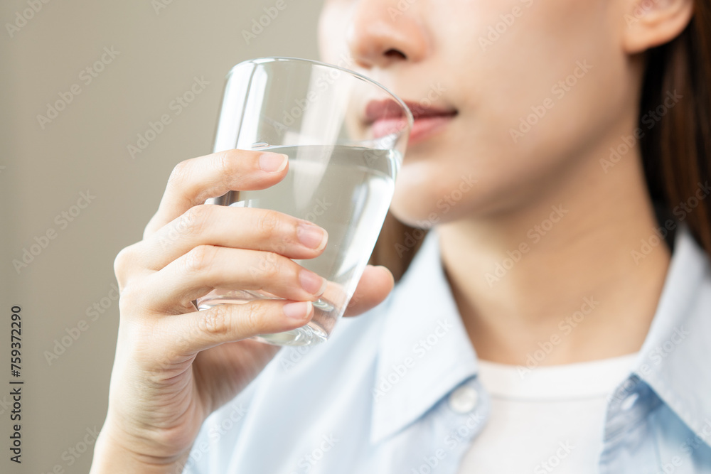 Clean freshwater concept. Woman drink mineral water in the morning for good health. Clean freshwater concept. Woman drink mineral water in the morning for good health.