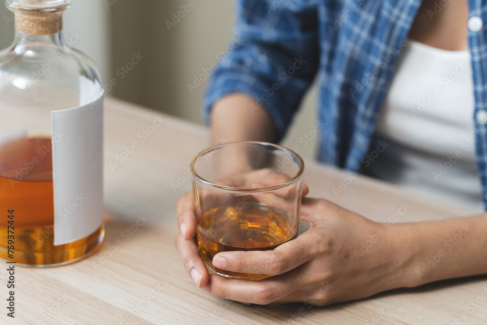 depression and anxiety woman drinking whisky alone. depression and anxiety woman drinking whisky alone.