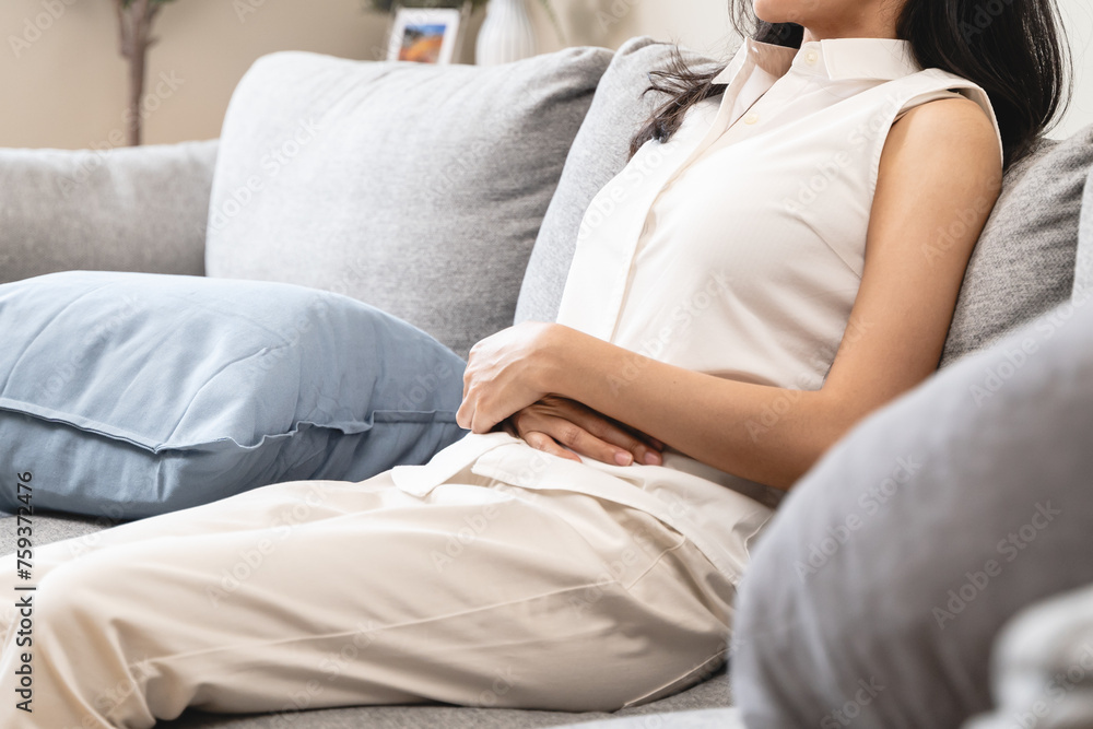 person feeling stomach pain menstruation on the bed. person feeling stomach pain menstruation on the bed.