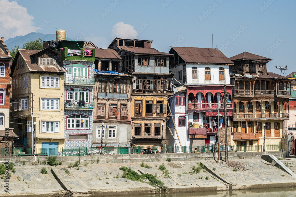 Crumbling old homes on the Jhelum River, Srinagar, Kashmir, India 
