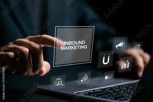 Inbound marketing strategy concept. Creating attraction for customer groups. Businessman using laptop with inbound marketing icon on virtual screen.