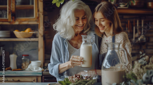 Senior woman and young woman making plant-based milk together