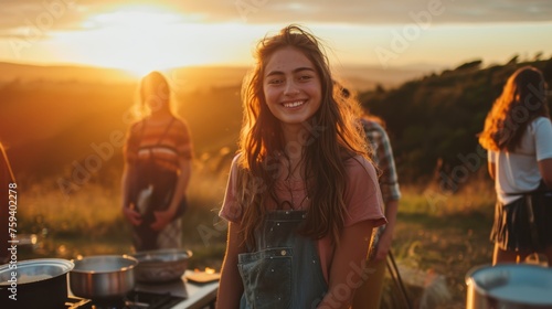 beautiful fun girl with friends, teens engaged in a comical outdoor cooking challenge