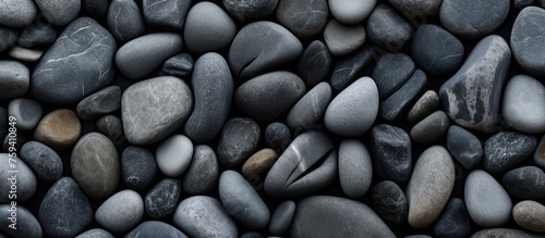 Texture of rocks arranged in a natural grey pattern.