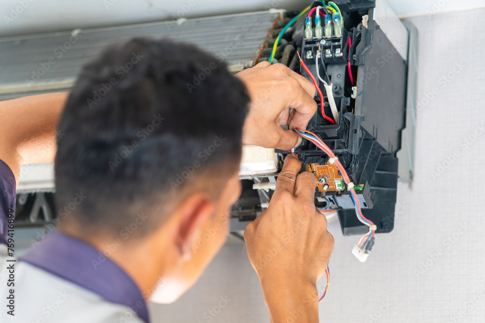 Repairman fixing and cleaning air conditioning system, Air Conditioning Repair, Male technician service for repair and maintenance of air conditioners Repairman fixing and cleaning air conditioning system, Air Conditioning Repair, Male technician service for repair and maintenance of air conditioners