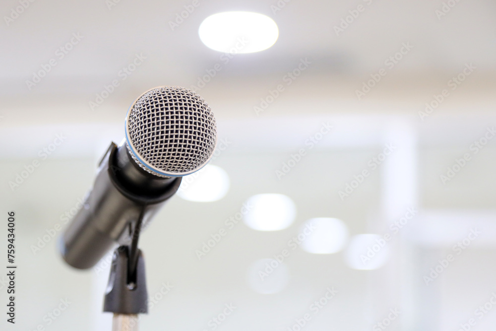 Microphone for press conference speaker report interview concepts or broadcasting public speaking speech presentation stage performance and reporter news with empty copy space background. Microphone for press conference speaker report interview concepts or broadcasting public speaking speech presentation stage performance and reporter news with empty copy space background.