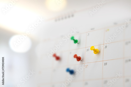 Pin on blank desk calendar in office workplace concept time management event planner or personal organization for business meeting and appointment reminder and schedule planning or holiday plan.