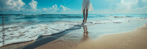 A woman is walking on the beach with the ocean in the background