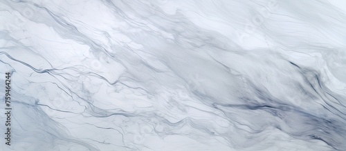 A close up of a grey marble texture resembling a snowy slope in freezing winter. The pattern is reminiscent of an ice cap with electric blue veins resembling cumulus clouds